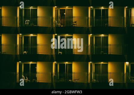 Hotel windows at night texture and background Stock Photo