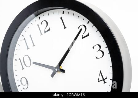 A creative macro shot of the face of an old, dirty, broken, and discarded plastic wall clock. Stock Photo