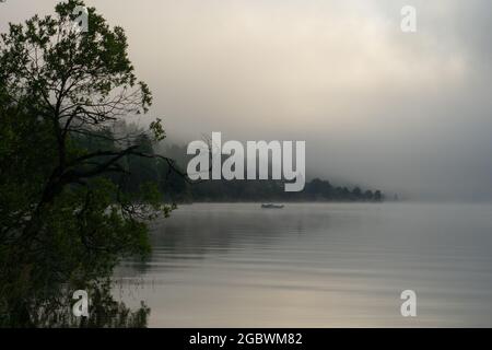 An early morning at Lac de Joux, Switzerland: Beautiful scenery with fog during sunrise Stock Photo