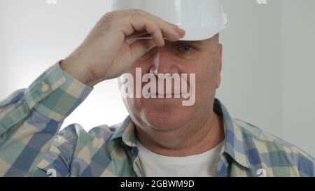 Portrait with an Engineer Wearing Helmet and Smiling Happy. Stock Photo