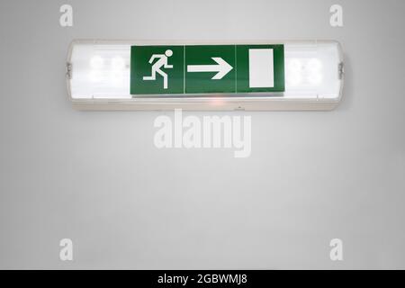 Emergency Evacuation Exit Sign. Fire Escape Guide Stock Photo