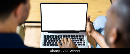 Couple Looking At Empty Laptop Computer Screen Stock Photo