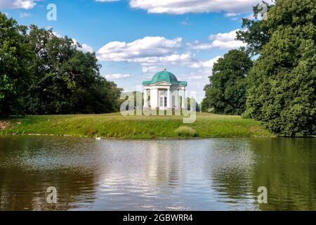 Park Karlsaue in Kassel with beautiful view to the idyllic swan island, Germany Stock Photo