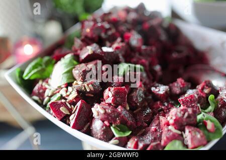 Salad with red beets and mixed seeds. Shot taken in natural light. Stock Photo