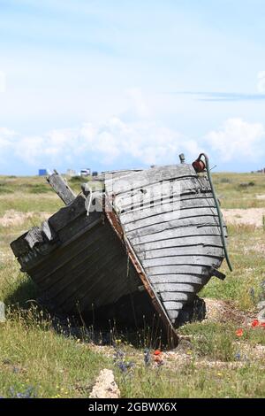 Old neglected boats on Dungeness beach Stock Photo