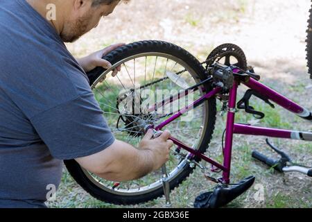 Man repairing bicycles a handsome bike 