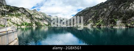 panoramic view of the Cavallers reservoir surrounded by high mountains, river Noguera de Tor in Ribagorza, Boí valley, in the Lleida Pyrenees, Catalon Stock Photo