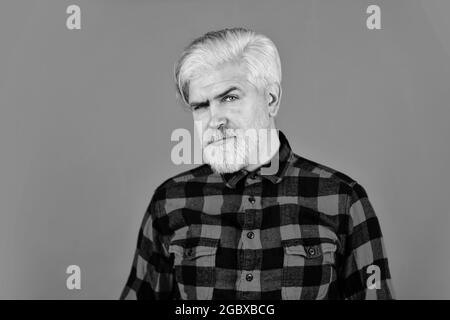 Fashion trend. Bearded man checkered shirt. Hipster dyed beard. Hairdresser and barbershop. Coloring beard. Expression of inner you. Moisturise and Stock Photo