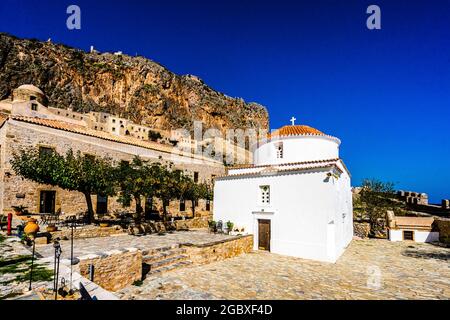 View on Monemvasia street panorama with old houses and Panagia Chrysafitissa church in ancient town, Peloponnese, Greece Stock Photo