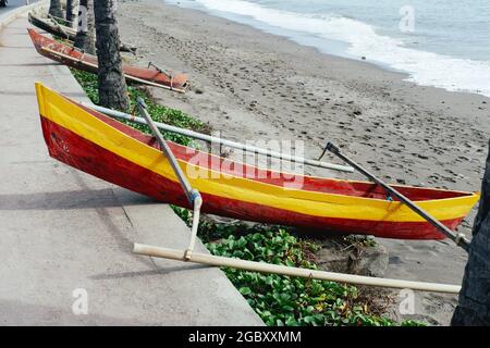 Fishing boats are moored on a Dili, Timor Leste beach. Stock Photo