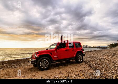PuertoVallarta, Jalisco, Mexico - 07  27  20 : The 2019 Jeep Wrangler Unlimited Sahara off-road with the ocean and cityscape in the background Stock Photo