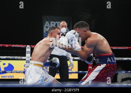 BRESCIA, ITALY - MAY 15: Mario Alfano (red) and Nicola Henchiri (white) exchange punches during their fight for the EU super featherweight title at the Mario Rigamonti Sport Center on May 15, 2021 in Brescia, Italy.  Credit: Stefano Nicoli/Speed Media/Alamy Live News Stock Photo