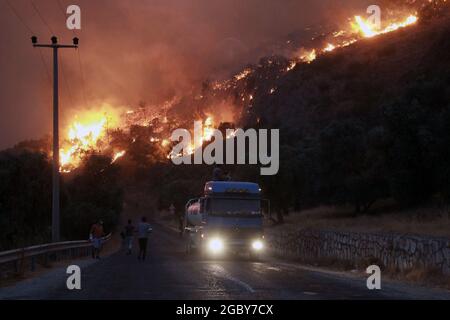 August 3, 2021, MuÄŸla, Milas, Turkey: Turkey has been struggling with forest fires in many provinces for a week. The fire in Bodrum district of MuÄŸla is about to reach the thermal power plant. (Credit Image: © Sedat ElbasanZUMA Wire) Stock Photo