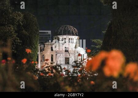 Hiroshima, Japan. 05th Aug, 2021. The Atomic Bomb Dome lights up at night in the Peace Memorial Park. This Friday will mark the 76th anniversary of the atomic bombing of Hiroshima, which killed about 150,000 people and destroyed the entire city for the first bombing with a nuclear weapon in war. Limited guests and Japan's dignitaries including Prime Minister Yoshihide Suga will attend the Peace Memorial Ceremony amid the coronavirus pandemic. Credit: SOPA Images Limited/Alamy Live News Stock Photo