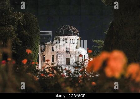 Hiroshima, Japan. 05th Aug, 2021. The Atomic Bomb Dome lights up at night in the Peace Memorial Park. This Friday will mark the 76th anniversary of the atomic bombing of Hiroshima, which killed about 150,000 people and destroyed the entire city for the first bombing with a nuclear weapon in war. Limited guests and Japan's dignitaries including Prime Minister Yoshihide Suga will attend the Peace Memorial Ceremony amid the coronavirus pandemic. (Photo by Jinhee Masahiro Lee/SOPA Image/Sipa USA) Credit: Sipa USA/Alamy Live News Stock Photo