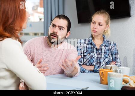 The son-in-law makes claims to the mother-in-law Stock Photo