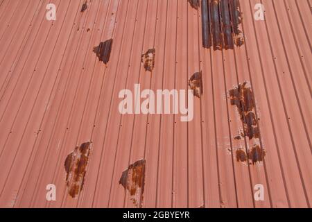 Old rusty galvanized red roof texture, corrosion by rain and sun light Stock Photo