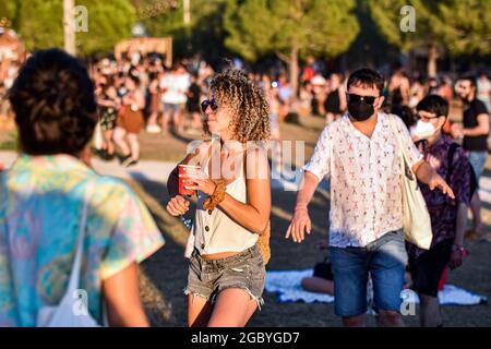 People with and without face masks attend the Festival Vida 2021.The Vida 2021, Canet Rock and Cruïlla music festivals, which were held in early July 2021 in Catalonia, left 2,279 Covid-19 positives among their 49,570 attendees, which included antigen tests at the access doors, according to a report from the Department of Health of the Government of Catalonia made 14 days after the Music Festivals. Credit: SOPA Images Limited/Alamy Live News Stock Photo