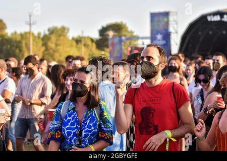 People with and without face masks attend the Festival Vida 2021.The Vida 2021, Canet Rock and Cruïlla music festivals, which were held in early July 2021 in Catalonia, left 2,279 Covid-19 positives among their 49,570 attendees, which included antigen tests at the access doors, according to a report from the Department of Health of the Government of Catalonia made 14 days after the Music Festivals. Credit: SOPA Images Limited/Alamy Live News Stock Photo