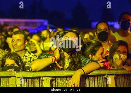 People with and without face masks attend the Festival Vida 2021.The Vida 2021, Canet Rock and Cruïlla music festivals, which were held in early July 2021 in Catalonia, left 2,279 Covid-19 positives among their 49,570 attendees, which included antigen tests at the access doors, according to a report from the Department of Health of the Government of Catalonia made 14 days after the Music Festivals. Credit: SOPA Images Limited/Alamy Live News Stock Photo