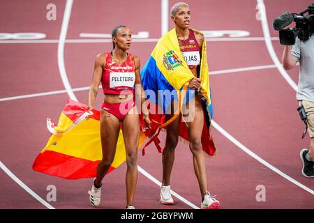 TOKYO, JAPAN - AUGUST 1: Ana Peleteiro of Spain and Yulimar Rojas of Venezuela poses with a flag of Spain and Venezuela after competing on Women's Triple Jump Final during the Tokyo 2020 Olympic Games at the Olympic Stadium on August 1, 2021 in Tokyo, Japan (Photo by Yannick Verhoeven/Orange Pictures) Stock Photo