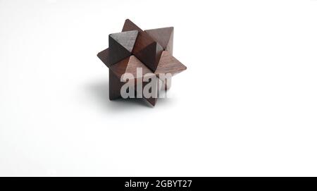 Complex wooden puzzle with white space for copy Stock Photo