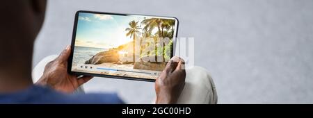Watching Movie Online Or TV On Tablet Stock Photo