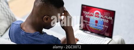 Ransomware Extortion Attack On Laptop. Cyber Security Stock Photo