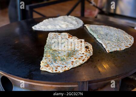 Saj pies or Saj Bakery or flat breads a type of street food in many Countries. Stock Photo