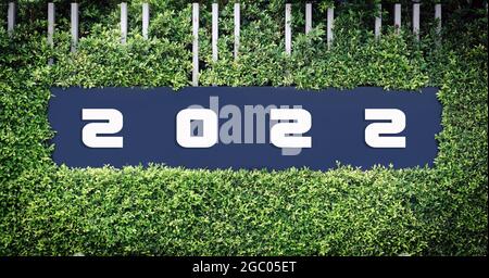 Number 2022 logo on the framed by green leaves, use happy news year concept. Stock Photo