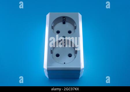 Electric double socket on a blue background Stock Photo