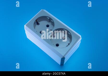 Electric double socket on a blue background Stock Photo