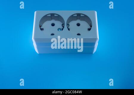 Electric double socket on a blue background Stock Photo