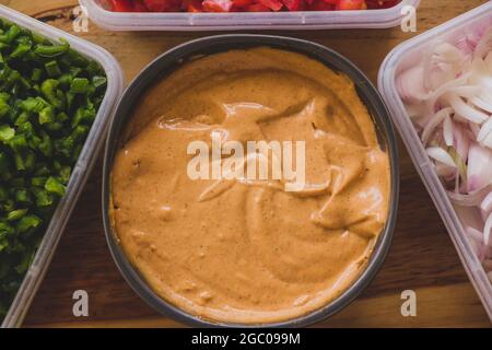 Spicy Mayonnaise. Tray of spicy mayonnaise for stuffing hamburgers. Spicy sauce for your burgers. Burger sauce. Sauce and vegetables for burgers. Stock Photo