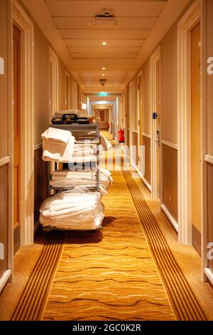 Housekeeping Trolley in Hotel Corridor Stock Photo