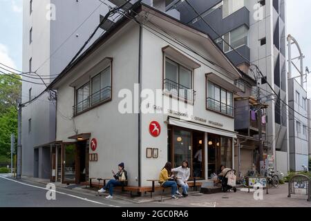 Tokyo, Japan. 28th Apr, 2017. People sit outside Fuglen cafe in Tomigaya. (Photo by Damon Coulter/SOPA Images/Sipa USA) Credit: Sipa USA/Alamy Live News Stock Photo