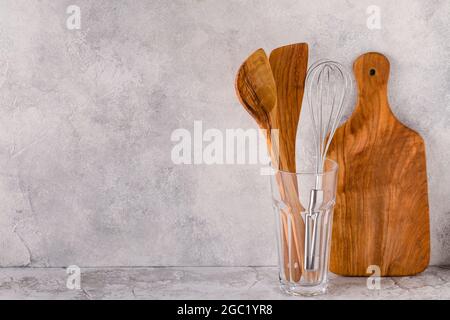 Kitchen utensils for eating and cooking on a light table. Stock Photo