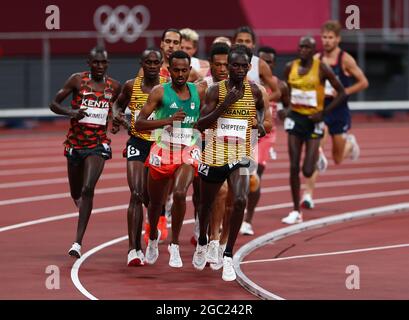 Tokyo, Japan. 6th Aug, 2021. Athletes compete during the Men's 5000m Final at the Tokyo 2020 Olympic Games in Tokyo, Japan, Aug. 6, 2021. Credit: Lan Hongguang/Xinhua/Alamy Live News Stock Photo