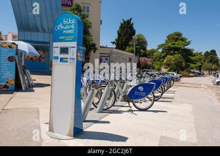 Porec, Croatia- July 10th 2021. A bike share scheme in historic medieval coastal town of Porec in Istria, Croatia Stock Photo