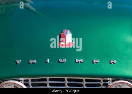 Plougasnou, France - July 17 2021: The Triumph TR3 is a British sports car produced between 1955 and 1962 by the Standard-Triumph Motor Company of Cov Stock Photo