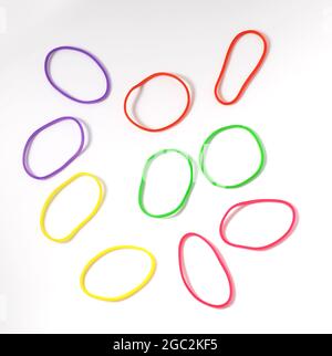 Group of multicolor rubber money bands isolated on white, round rubber band Stock Photo