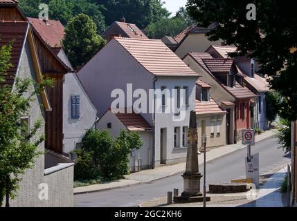 26 July 2021, Brandenburg, Bad Belzig: The Electoral Saxon post office milepost stands in Bahnhofsstraße in the town in the district of Potsdam-Mittelmark. The coat of arms decorated distance column is under monument protection. Photo: Soeren Stache/dpa-Zentralbild/ZB Stock Photo