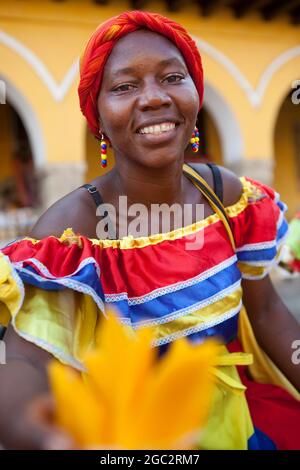 Beautifully dressed Palenquera / fruit vendor in the historic city of Cartagena, Colombia. Stock Photo