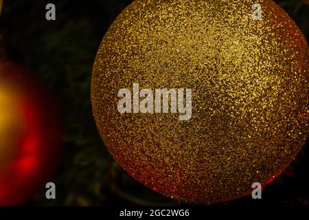 Various Christmas tree decorations and red blurred light on background Stock Photo