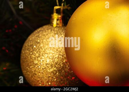 Various Christmas tree decorations and red blurred light on background Stock Photo