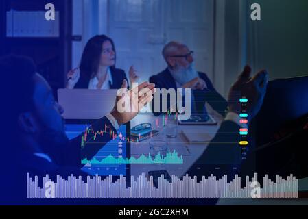 Business Executives Watching Presentation in the Conference Room. Working Projector on the Table.  Stock Photo