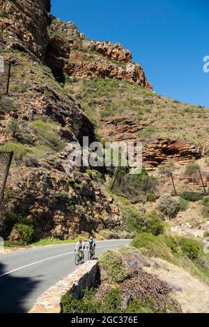 Cyclists on Chapman's Peak drive, Cape Town, South Africa Stock Photo