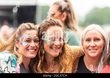 Excited concert-goers enjoying a music festival