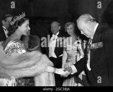 HRH Princess Elizabeth greets Mr Winston Churchill at the Guildhall dinner at which the Lord Mayor's National Thanksgiving Fund was launched. In the background can be seen the Prime Minister Mr Atlee and Mrs Atlee 23rd March 1950 Stock Photo