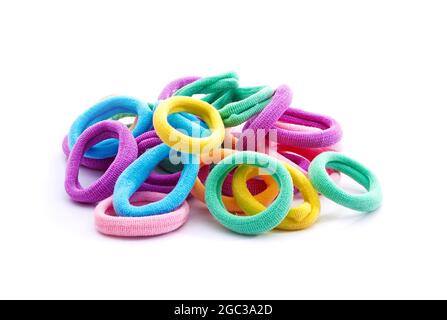 Heap of various hair ties. Multicolored elastics isolated on white background Stock Photo